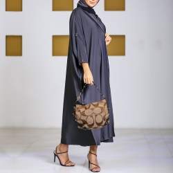 Pre Owned Coach Beige/Dark Brown Signature Canvas and Leather Carly Hobo