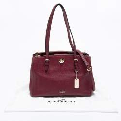 مملوكة مسبقًا حقيبة يد توتس كوتش شارلي كاريال جلد عنابي قفل دوار