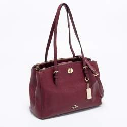 مملوكة مسبقًا حقيبة يد توتس كوتش شارلي كاريال جلد عنابي قفل دوار