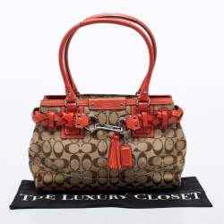 Pre Owned Coach Beige/Orange Signature Canvas and Leather Hampton Tote