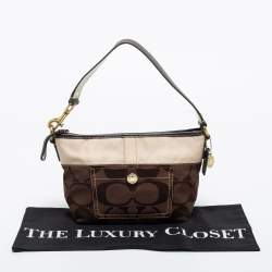 Pre Owned Coach Brown/Beige Signature Canvas Front Pocket Baguette Bag