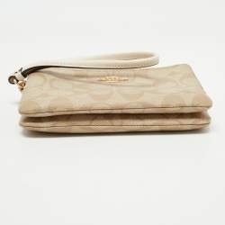 Pre Owned Coach Beige Signature Coated Canvas and Leather Double Zip Wristlet Pouch