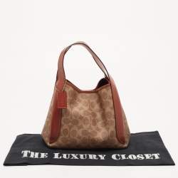 Pre Owned Coach Beige/Brown Signature Coated Canvas and Leather Hadley 21 Hobo