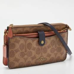 Pre Owned Coach Beige/Peach Signature Coated Canvas and Leather Noa Pop Up Crossbody Bag