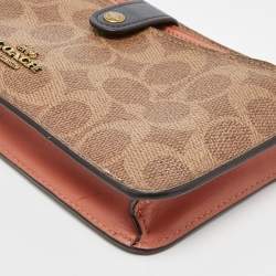Pre Owned Coach Beige/Peach Signature Coated Canvas and Leather Noa Pop Up Crossbody Bag
