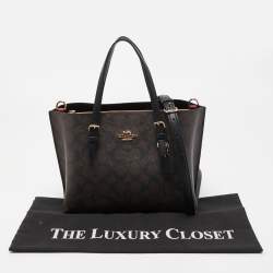 Pre Owned Coach Brown/Black Signature Coated Canvas Tatum Caryall Tote