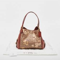 Pre Owned Coach Beige/Brown Signature Prairie Floral Canvas and Leather Edie 31 Satchel