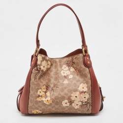 Pre Owned Coach Beige/Brown Signature Prairie Floral Canvas and Leather Edie 31 Satchel