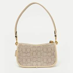 Pre Owned Coach Beige/Cream Signature Canvas and Leather Swinger Pochette Bag
