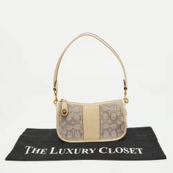 Pre Owned Coach Beige/Cream Signature Canvas and Leather Swinger Pochette Bag