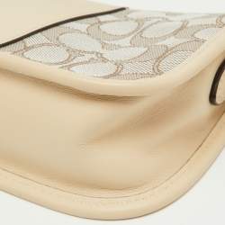 Pre Owned Coach Beige/Cream Signature Canvas and Leather Swinger Pochette Bag