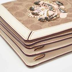 Pre Owned Coach Beoge/Old Rose Signature Coated Canvas and Leather Rose Embellished Riley Crossbody Bag