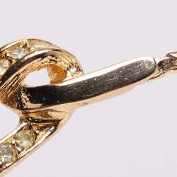 مملوكة مسبقًا قلادة ديور ذهبية اللون بحجر الراين وقلب مزخرف