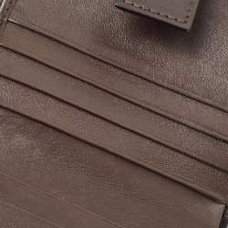 Pre Owned Dior Brown/Beige Calfhair and Leather Buckle Flap Compact Wallet