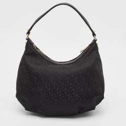 Pre Owned Dkny Black Monogram Canvas and Leather Zip Hobo