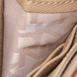 Pre Owned DKNY Beige/Red Canvas and Leather Zip Around Wallet