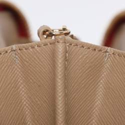 Pre Owned DKNY Beige/Red Canvas and Leather Zip Around Wallet