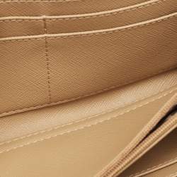 Pre Owned محفظة كونتيننتال دي كاي إن واي قماش بيج/أحمر بنمط مونوغرام بسحاب