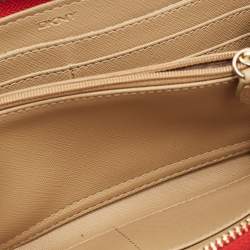 Pre Owned محفظة كونتيننتال دي كاي إن واي قماش بيج/أحمر بنمط مونوغرام بسحاب