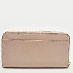 مملوكة مسبقًا محفظة دي كي إن واي جلد وردي فاتح بسحاب ملتف كبير الحجم