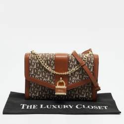 Pre Owned حقيبة كتف دي كي إن واي إيلا كبيرة قماش بنمط الشعار بني/بيج وجلد