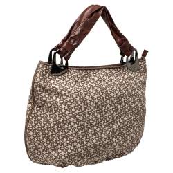 Pre Owned حقيبة هوبو دي كيه إن واي جلد و كانفاس مطبوع شعار الماركة بيج و بني