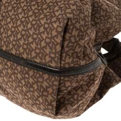 Pre Owned Dkny Brown Monogram Canvas and Leather Studded Hobo