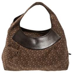 Pre Owned Dkny Brown Monogram Canvas and Leather Studded Hobo