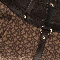 Pre Owned Dkny Brown Monogram Canvas and Leather Studded Hobo