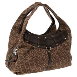 Pre Owned Dkny Brown Monogram Canvas and Leather Studded Hobo