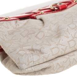 Pre Owned DKNY Beige/Orange Signature Canvas and Leather Kisslock Frame Clutch