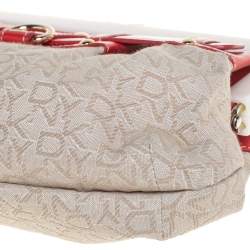 Pre Owned DKNY Beige/Orange Signature Canvas and Leather Kisslock Frame Clutch