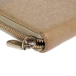 Pre Owned Dkny Metallic Beige Leather Zip Around Wallet