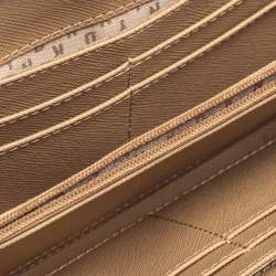 Pre Owned Dkny Metallic Beige Leather Zip Around Wallet