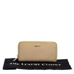 Pre Owned Dkny Metallic Beige Leather Zip Around Wallet