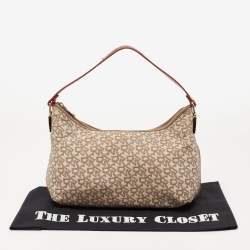 Pre Owned حقيبة دي كي إن واي باغويت جلد وكانفاس بالشعار بيج/لون الصدأ