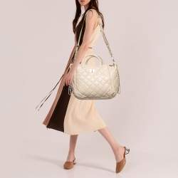 Pre Owned حقيبة يد توتس دي كي إن واي جلد بيج مبطن بسلسلة وقفل دوار