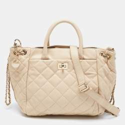 Pre Owned حقيبة يد توتس دي كي إن واي جلد بيج مبطن بسلسلة وقفل دوار