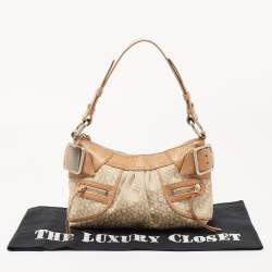 Pre Owned Dkny Beige/Light Green Monogram Canvas and Leather Buckle Baguette Bag 