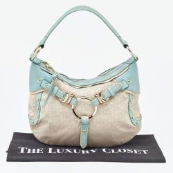 Pre Owned DKNY Cream/Blue Monogram Canvas and Leather Buckle Hobo