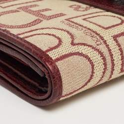 مملوكة مسبقًا Dolce & Gabbana Burgundy Monogram Fabric and Leather D Ring Trifold Wallet