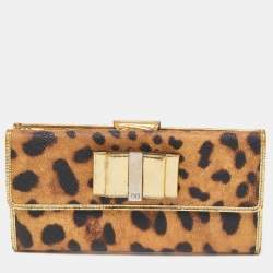 مملوكة مسبقًا Dolce & Gabbana Gold/Brown Leopard Print Coated Canvas and Laminated Leather Bow Flap Wallet
