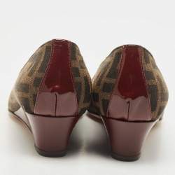 Pre Owned Fendi Burgundy/Brown Patent Leather and Tobacco Zucca Canvas Logo Plate Wedge Pumps Size 37.5