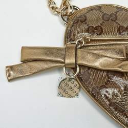 مملوكة مسبقًا حقيبة صغيرة غوتشي جلد وكنفاس GG كريستال بيج/ذهبي قلب