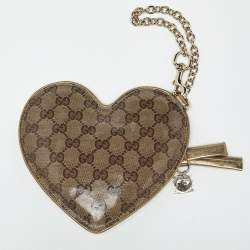 مملوكة مسبقًا حقيبة صغيرة غوتشي جلد وكنفاس GG كريستال بيج/ذهبي قلب