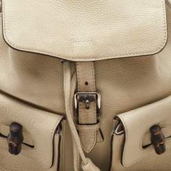 Pre Owned Gucci Off White Pebbled Leather GG Bamboo Tassel Backpack