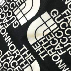 مملوكة مسبقًا حقيبة ظهر غوتشي سوداء وبيضاء وبنية