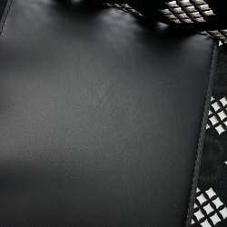 مملوكة مسبقًا حقيبة يد غوتشي بجلد أسود مزخرفة مع تفريغات بحجم متوسط