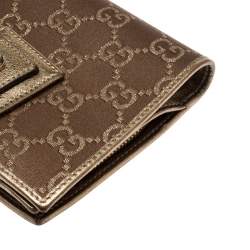 مملوكة مسبقًا محفظة غوتشي كومباكت حلقة D جلد وساتان ذهبية/ بنية