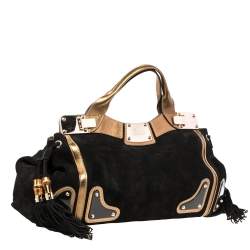 مملوكة مسبقًا حقيبة غوتشي ريس سو�يدي وجلد أسود/ ذهبي بيد علوية 